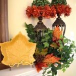 fall mantel decor with greenery and flowers