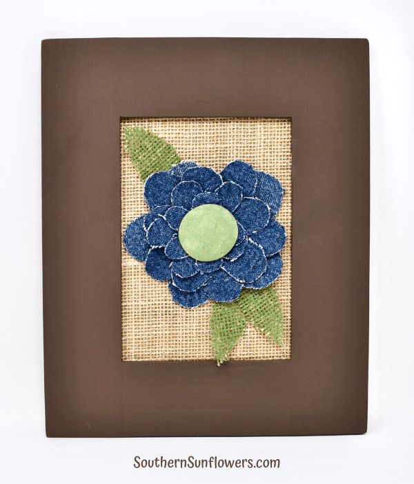 completed upcycled denim blue flower in frame