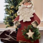 santa standing next to tree all completed for how to update christmas decorations