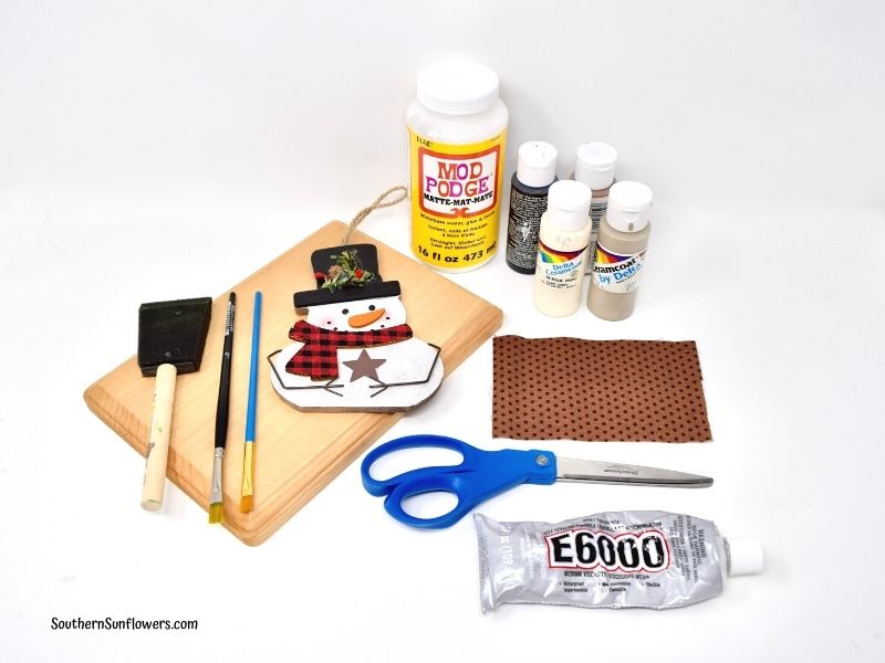 supplies needed to make the diy wooden snowman sign