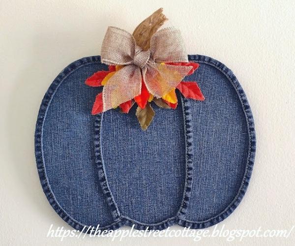 denim pumpkin sign with bow and fall leaves attached