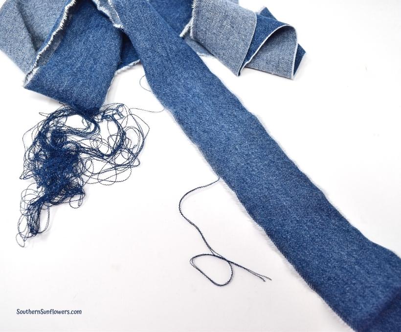 Christmas denim and burlap wreath project - fraying the sides of the denim fabric
