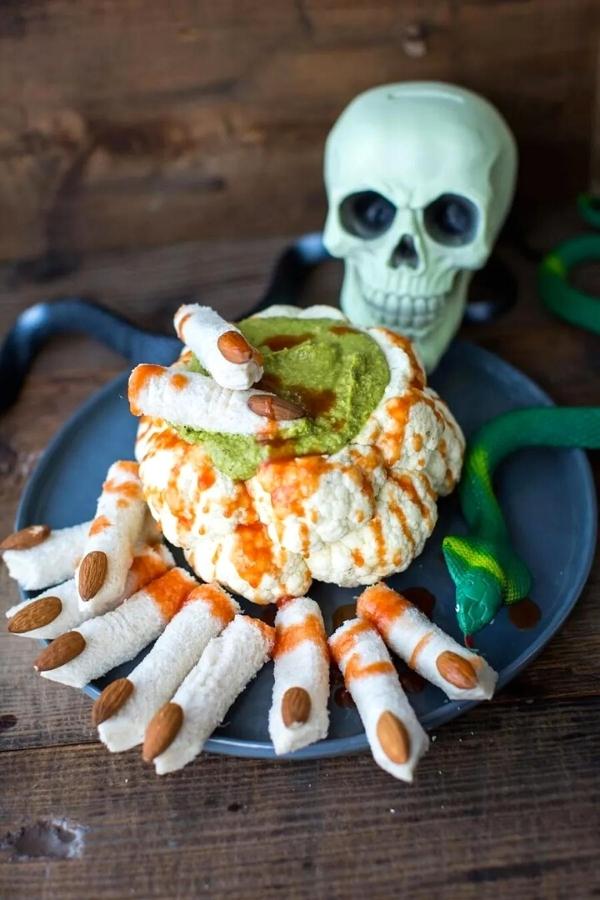 last minute halloween food ideas - roasted cauliflower and humus dip that looks like a brain with green slime