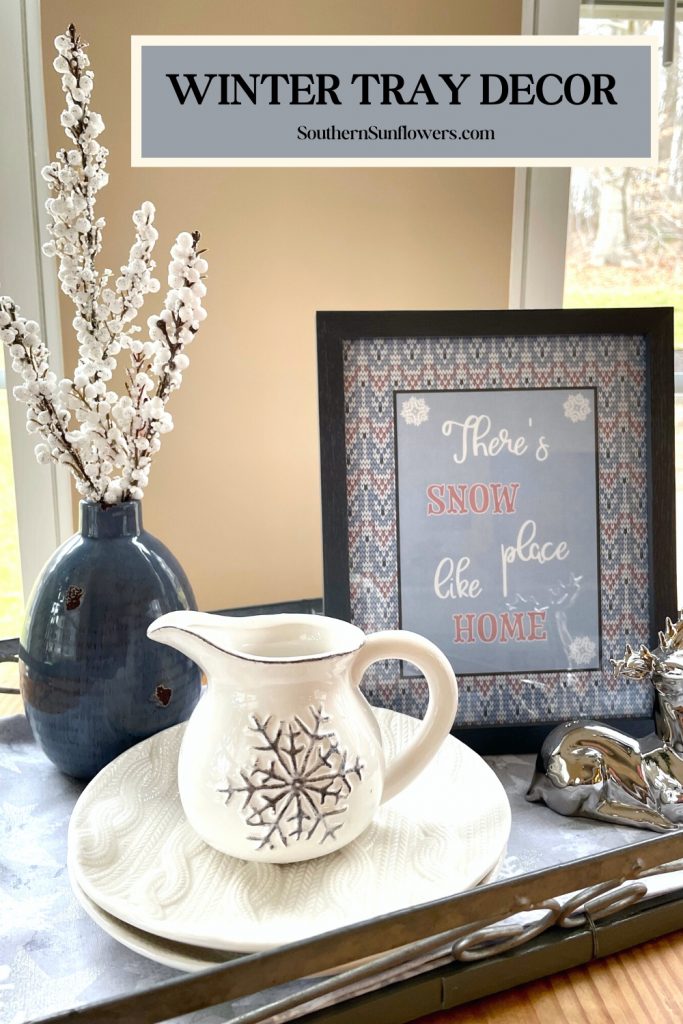 Graphic for winter tray decor ideas - home decor items in blue, white, and gray are displayed on a tray