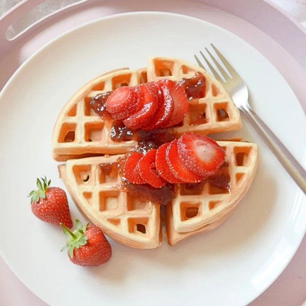 waffles topped with strawberries that was featured at the home matters link party #436
