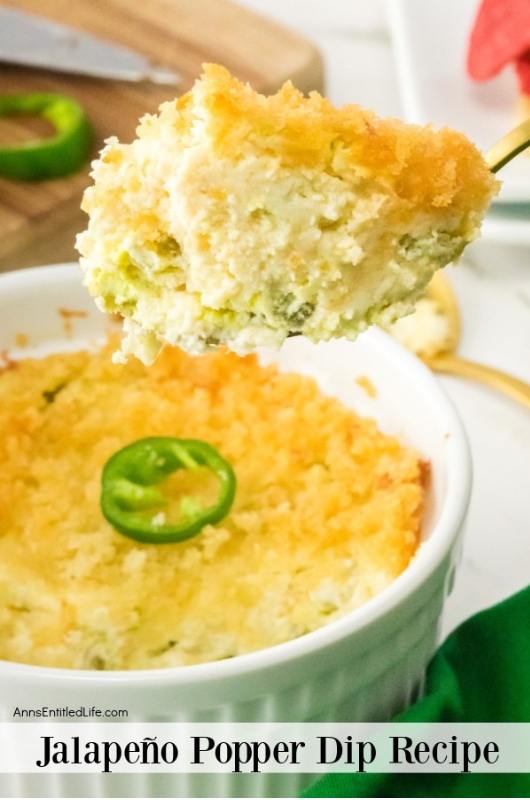 jalapeno popper dip being spooned out of a bowl