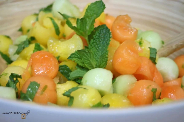 colorful melon salad in a bamboo bowl which was featured at the home matters link party