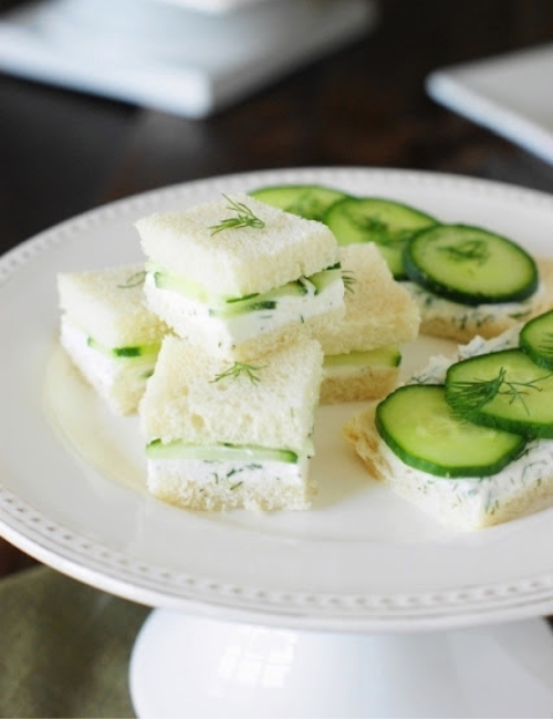 this white plate filled with cucumber tea sandwiches was featured at the home matters link party 442