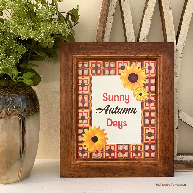 autumn sunflower free printable decor framed and propped on a mantle