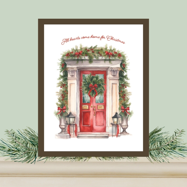 framed free watercolor Christmas art printable displayed on mantel