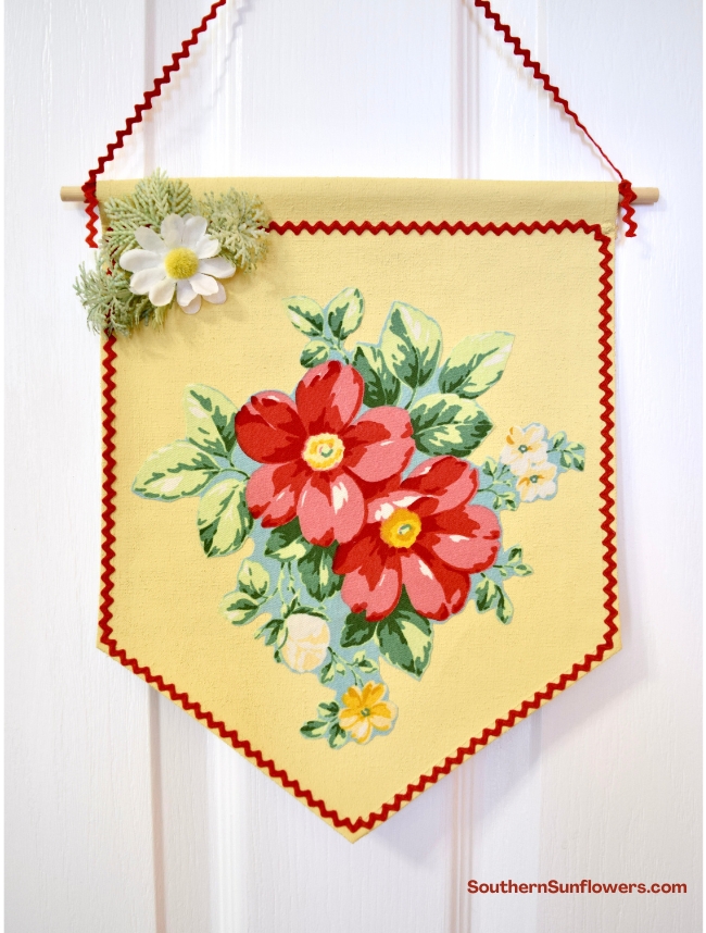 spring floral wall decor hanging on a door